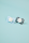 BIBS Supreme 2 PACK Silicone_Symmetrical_0-6m_ Iron GLOW_Baby Blue GLOW